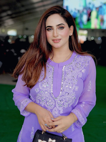 Imposing Mirror Lilac Purple Chikankari Outfit with intricate embroidery and mirror work.